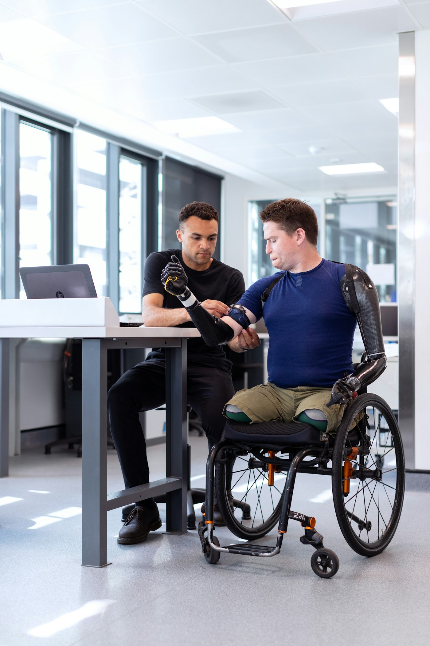 A supported employee focused on detailed hands-on work